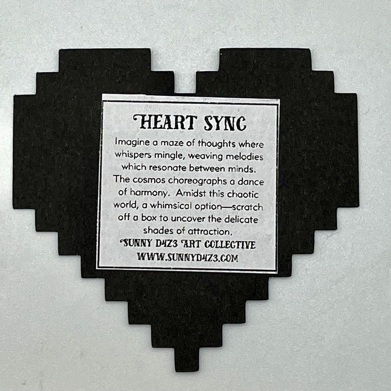 black heart card with label on the back.