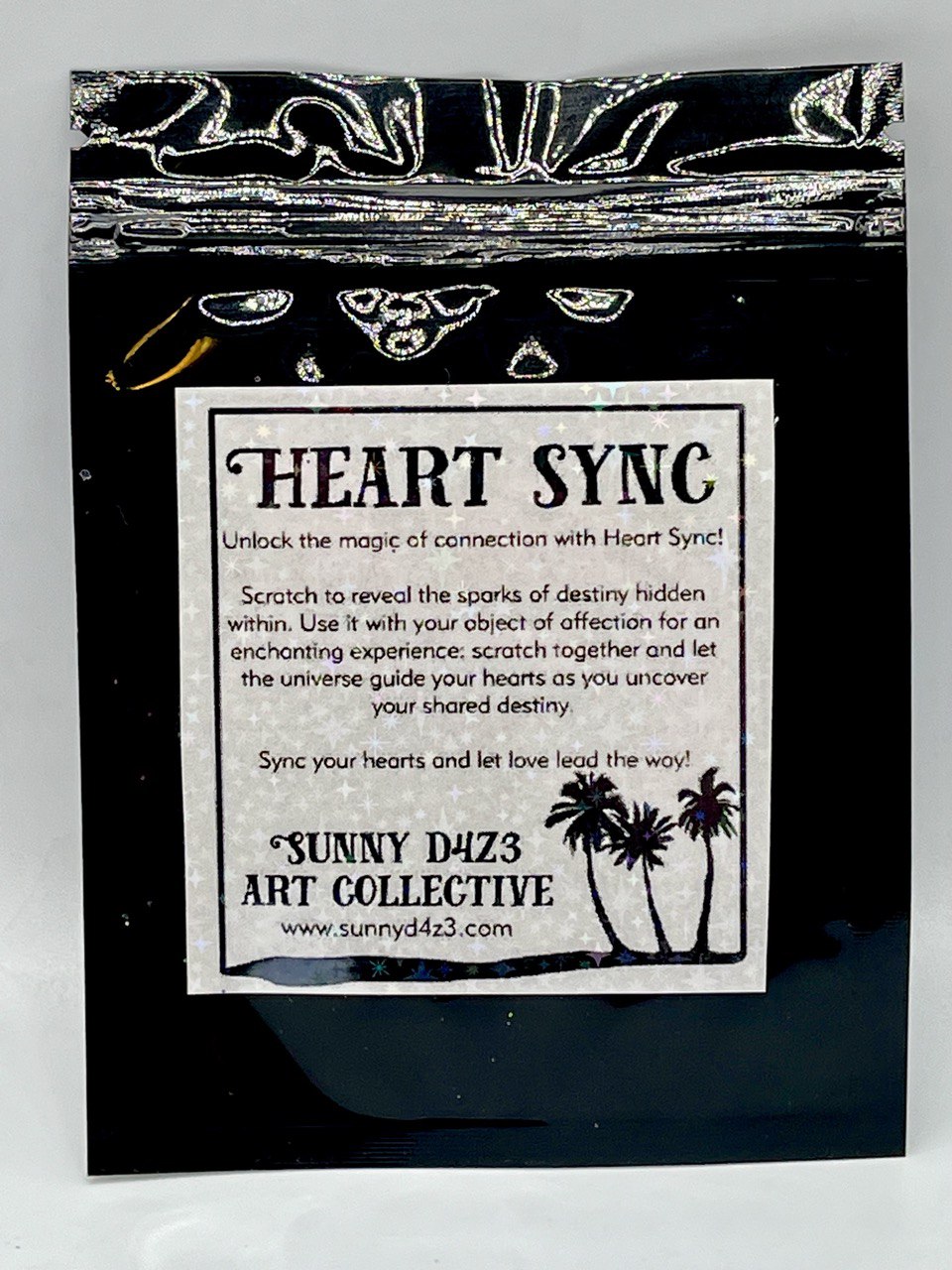 back of heart sync packaging with heart sync label:  the title is : heart sync.  sunny d4z3 art collective