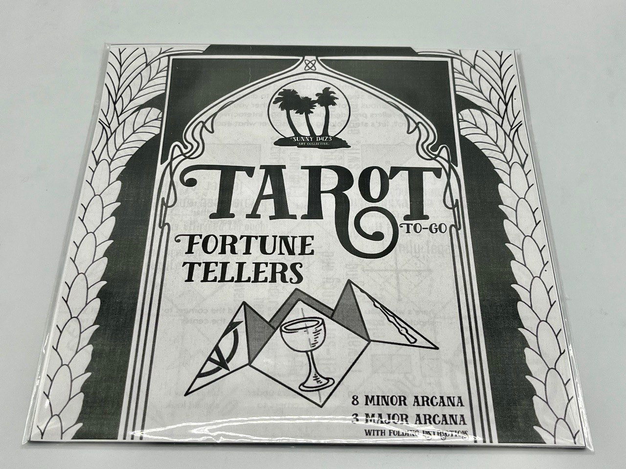 front cover of a pack of eleven tarot themed origami paper sheets